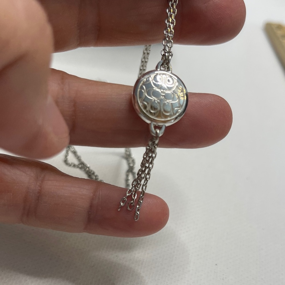 Elegant Coach Silver Tones Necklace with Intricate Coach C Logo Pendant - Picture 5 of 6